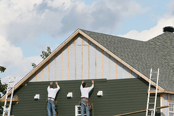 Professional Siding technician working in Raleigh, NC